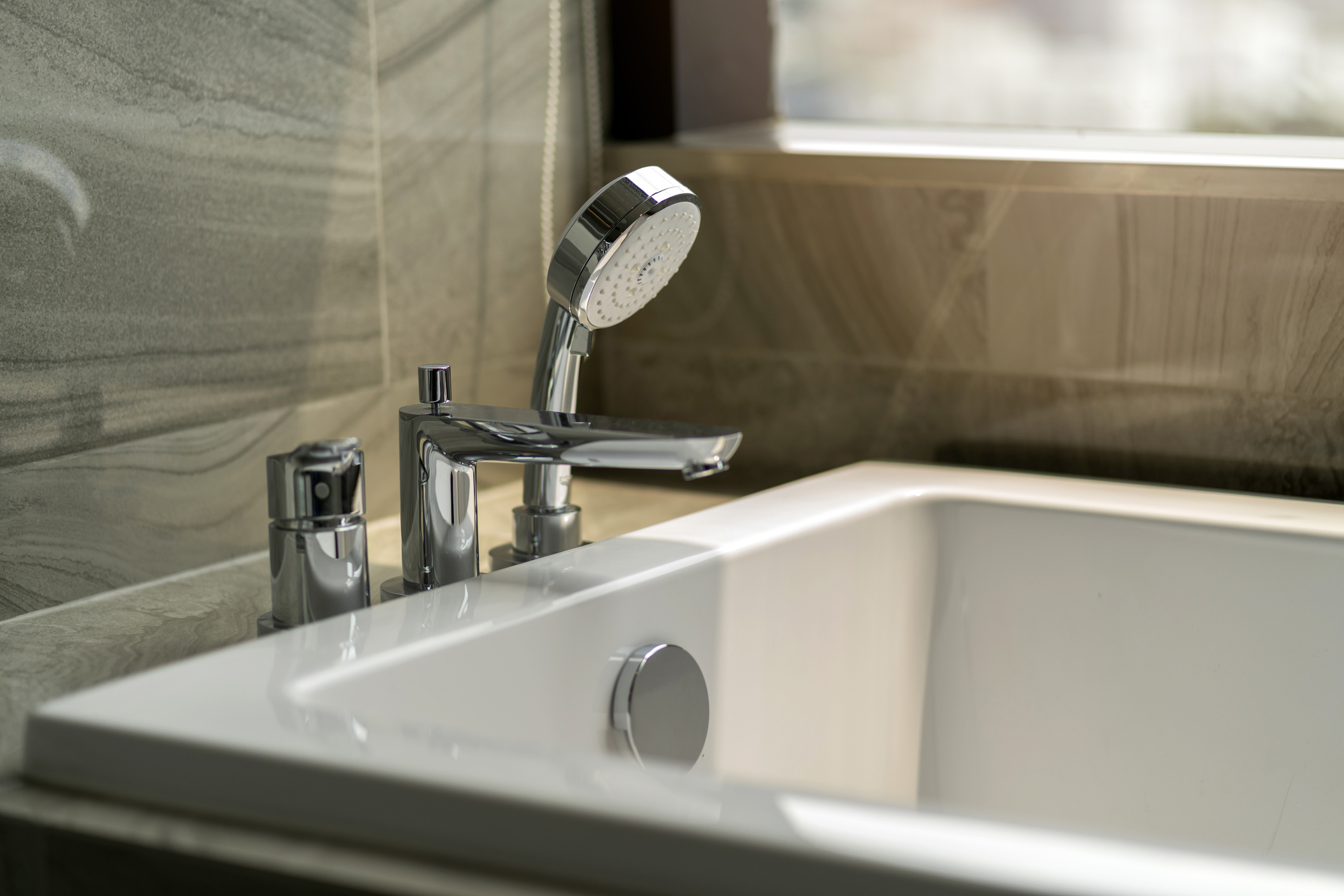 close up chrome faucet shower bath tub room  interior design